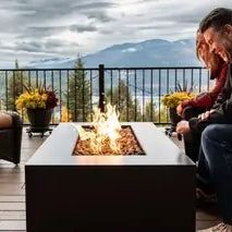 Relaxing backyard with sauna, fire pit, and water fountain for mental wellness