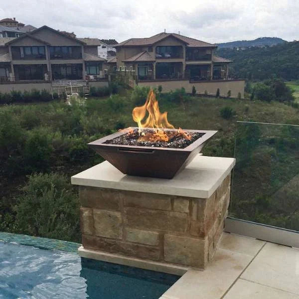 the outdoor plus maya 31 inch hammered patina copper fire bowl exterior view

the outdoor plus maya copper fire bowl round fire pit lit at night

the outdoor plus maya fire bowl patio setup close-up of flame and copper finish

the outdoor plus maya copper fire bowl burner interior detail