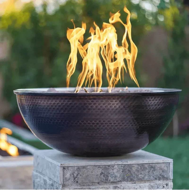 the outdoor plus sedona 27 inch hammered copper fire bowl exterior view

the outdoor plus sedona copper fire bowl patio fire pit flame at night

the outdoor plus sedona hammered copper fire bowl close-up burner interior

the outdoor plus sedona fire bowl outdoor living space setup