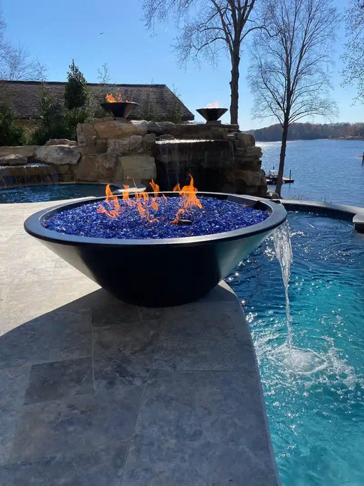 the outdoor plus cazo fire and water bowl exterior view

the outdoor plus cazo hammered copper fire water bowl patio setup

the outdoor plus cazo fire and water feature lit at night with flame and water

the outdoor plus cazo copper fire and water bowl stainless steel burner close up